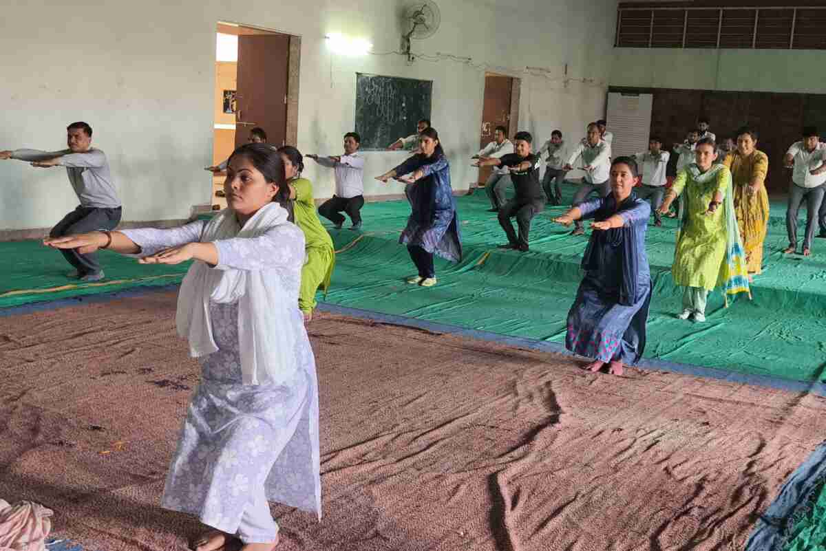 Students performing yoga under the guidance of instructor Manoj Ji at Jyoti Vidyapeeth School, Bagad