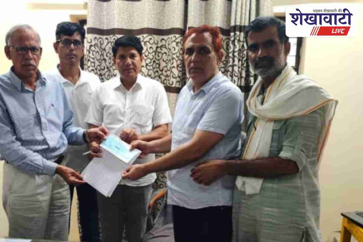 Urika villagers donating funds for school classroom construction