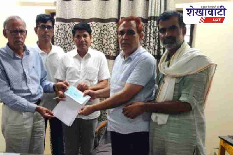 Urika villagers donating funds for school classroom construction