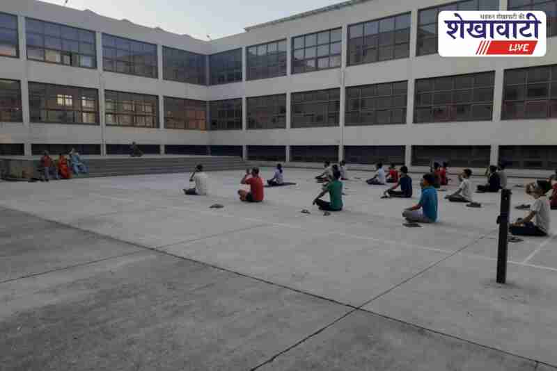 Medical students and doctors practicing yoga at Sikar Medical College
