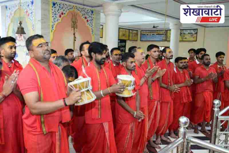 Devotees performing Rudrabhishek and chanting mantras at Budhgiri Madhi temple in Fatehpur during Shravan month religious celebrations