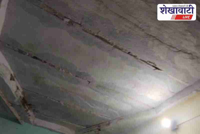 Government school with broken classrooms and high-voltage line overhead