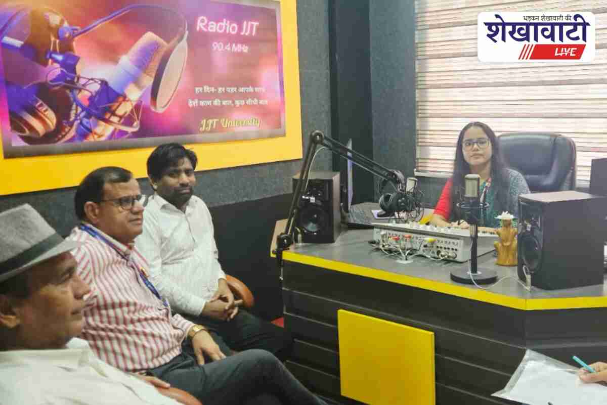 Officials inspect Radio JJT studio and equipment for grant approval