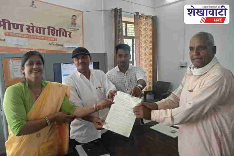 Residents receiving pattas and health services at Derwala camp, Jhunjhunu