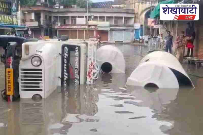 Pickup truck overturns near Surajpol Gate during heavy rain