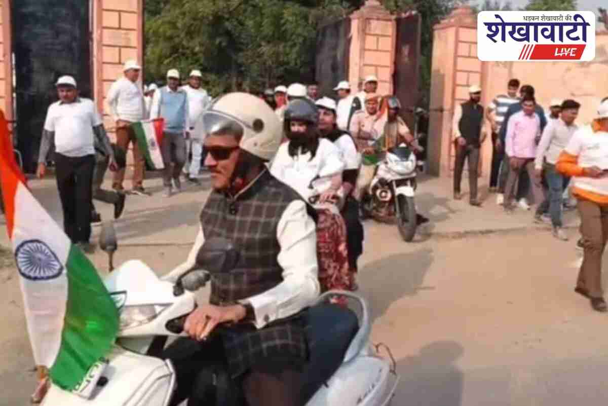 Jhunjhunu Collector Arun Garg rides scooter during Vande Mataram 150 rally