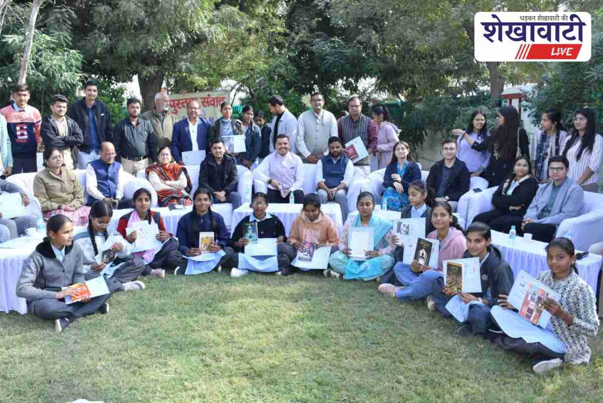 Churu Collector Abhishek Surana interacts with students in book dialogue