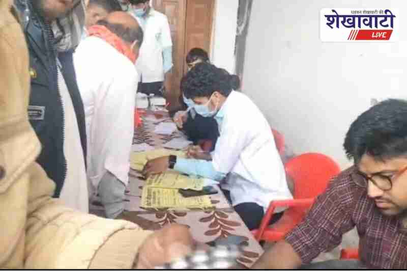 Doctors examine patients at Dukhiya Hospital free health camp