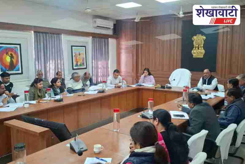 Officials reviewing government schemes in district meeting at Sikar
